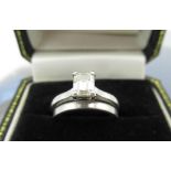 Hallmarked platinum solitaire ring with emerald cut diamond in four claw setting, 0.70ct, colour