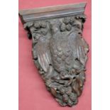 Edwardian mahogany wall bracket, carved with an eagle perched in an oak tree, W28cm D13cm H43cm