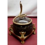 French Regency style table centrepiece, the marble dome entwined with gilt metal serpent, on