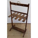Early C20th Country House mahogany boot and whip rack, with eight pegs, brass carry handle on
