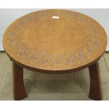 Thomas Gnomeman Whittaker - Oak coffee table, circular top carved with strapwork on three angular
