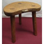 Robert Mouseman Thompson - Oak calf stool, kidney shaped top on three octagonal tapering supports,