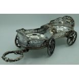 Victorian electroplated decanter wagon, waisted pierced galleried body with gadrooned edge on four
