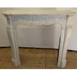 French Rococo Revival white marble fire surround, shaped mantle and frieze on scrolled supports,