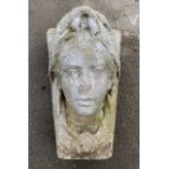 C19th stone tapering rectangular keystone, relief carved as a female head, W30cm D31cm H52cm