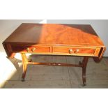 Regency style yew sofa table, rectangular moulded outlined top with two D shaped fall leaves, two