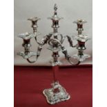 C20th Rococo style EPNS four light candelabra, three reeded scroll branches with urn sconces, on