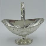 Victorian hallmarked Sterling silver navette bonbon dish with swing handle on circular pedestal