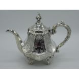 Victorian hallmarked Sterling silver teapot with octagonal tapered body and leaf scroll finial, on