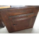 C19th French pitch and pine wall cupboard, scumbled panelled door with cast iron handles and