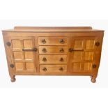 Sid Pollard of Thirsk - Oak sideboard with raised back and four drawers enclosed by two six panelled