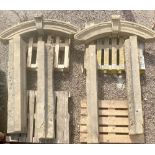 Pair of C19th stone door frame arches, angular uprights and arched top with scrolled cresting,