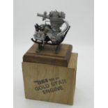 C20th cast metal model of a BSA Gold Star 500cc motor cycle engine, on brass stand and wooden