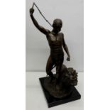 After Guillaume Coustou, patinated bronze model of a youth with lion, impressed mark to naturalistic