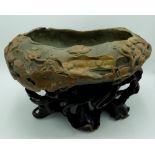 Chinese dark green and brown Duan stone brush washer in the form of a lily pad, rim carved with
