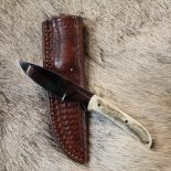 Harry Bowden skinning knife, full tang with antler two piece handle in tooled leather sheath blade