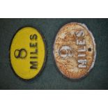 Two vintage cast iron relief oval mile markers, 8 Miles and 9 Miles, 37cm x 27cm