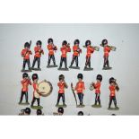 Vintage Britain’s band of the Coldstream Guards. 24 standing bandsmen and 3 other mounted soldier