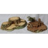 Pendelfin woodland house under tree stumps, pontoon jetty with HMS Shrimp life buoy