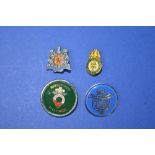 Four small enamel pin badges including Caledonian railway, Isle of White steam railway and the