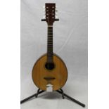 Flat backed eight string mandolin, made by P. S. Royle of Manchester, England, in original padded
