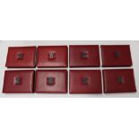 Collection of eight Royal Mint UK Deluxe Proof Coin Sets in original boxes with certs, date years