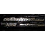 Cased Gemeinhardt silver finished flute with various makers marks including 'Gemeinhardt Elkhart USA