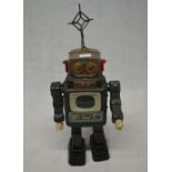 Vintage tin plate walking battery operated robot, works intermittently