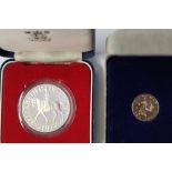 ERII 1977 silver proof commemorative crown in original box with cert. together with a Isle of Man