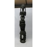 Ornately carved two piece African fertility statue with naked lady on carved plinth depicting