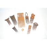 Selection of eight African carved wood combs of various sizes and design (8)