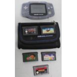 Gameboy Advance with case and five games including Scooby Doo, NES Classics Pacman, etc (working