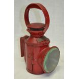 Red railway guards oil lamp, with Woodford plaque