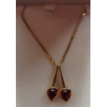 18ct yellow gold pendant with two garnets inset in cherry shaped mount, L2cm, 750, London, 2000 on a