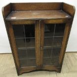 C20th oak bookcase with galleried top above two lead glazed doors, W62cm D31cm H92cm