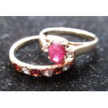 15ct yellow gold and ruby ring with oval cut ruby flanked by two round cut white stones, stamped