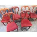 Set of six Victorian mahogany dining chairs with lift up upholstered seats on turned supports