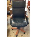 Black leather office chair on wheels