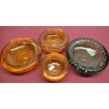 Four Whitefriars bubble glass ashtrays in amber and sea green