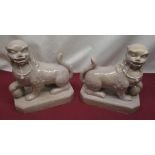 Early C20th South East Asian pair of glazed stoneware temple dog figures, H25cm