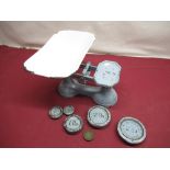 Early C20th cast metal kitchen scales and a collection of weights