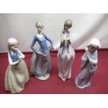 Four Nao porcelain figures