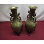 Pair of mid C20th Chinese bronze vases with looped dragon handles, body etched with dragons,