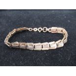 9ct rolled rose gold articulated bracelet with bright cut decoration, 12.3g