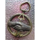 C19th cast metal Masonic type medal in the form of Ouroboros encircling clasped hands with a central