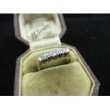 18ct yellow gold, graduated five stone ring in platinum mount, stamped 18ct Plat, size O, 2.4g