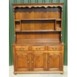 C20th oak dresser, two plate racks above three drawer base with three panelled doors, H187cm,