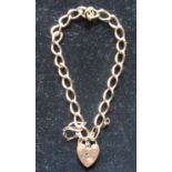 Hallmarked 9ct yellow gold bracelet by GFLD, Sheffield, 1988 with a heart padlock clasp by ASJ, 375,