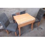 Small kitchen lightwood drop leaf table and a pair of grey upholstered dining chairs (3)