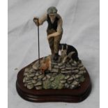 Border Fine Arts figure of a Shepherd on a dry stone wall with his dog H20cm